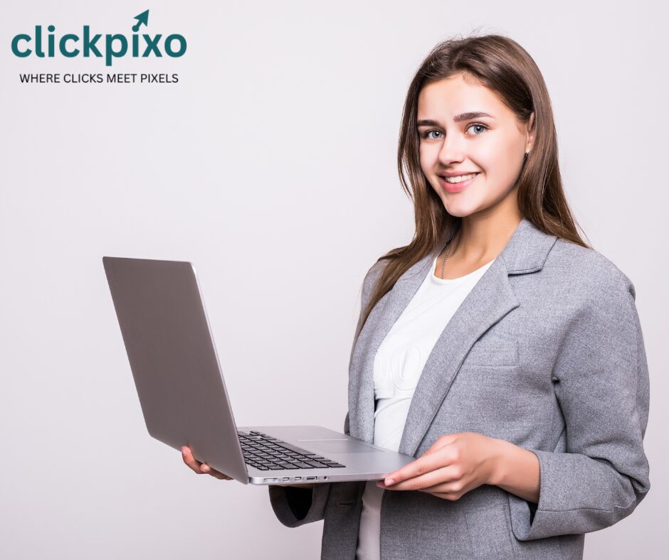 SEO consultant in kamla nagar standing with laptop and smiling face.
