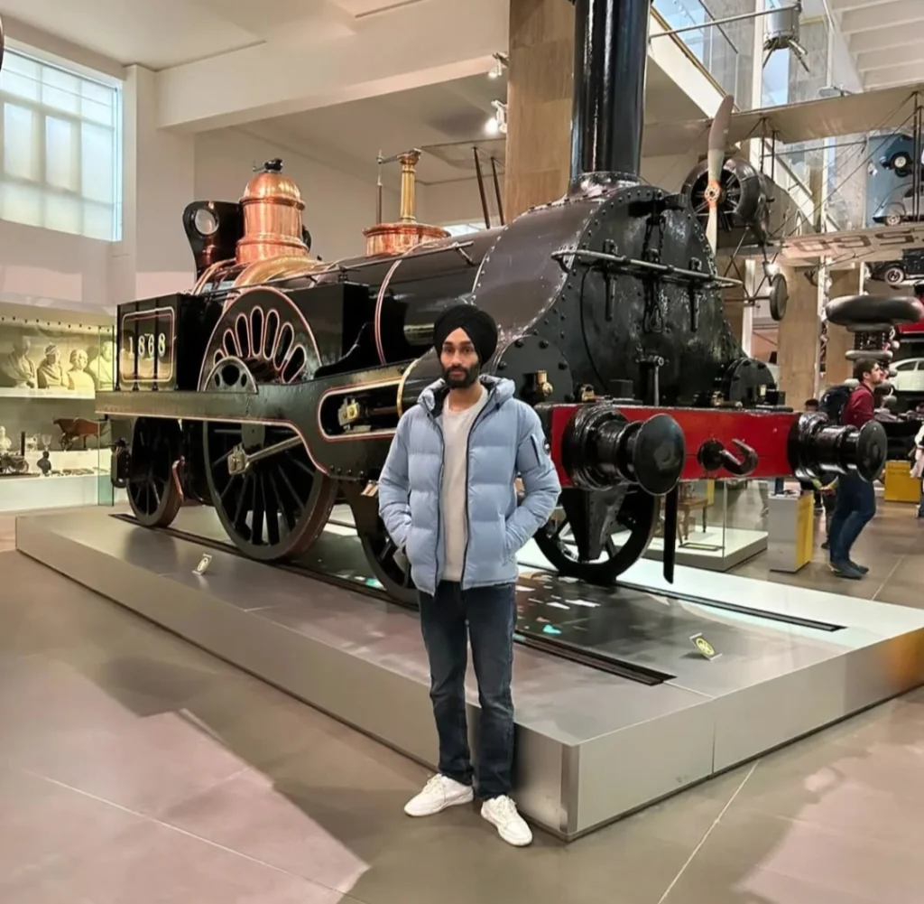 SEO course london mentor standing with train Gurmail Singh