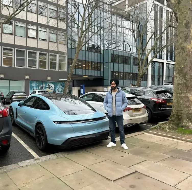 SEO expert in kamla nagar standing with beautiful car